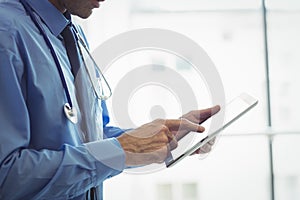 Doctor using digital tablet