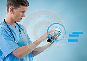 Doctor using digital tablet with digitally generated icons