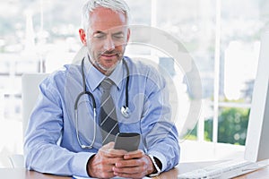 Doctor using his smartphone