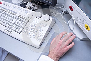 Doctor using laptop and electronic medical record (EMR) system. Digital database of patient's health care