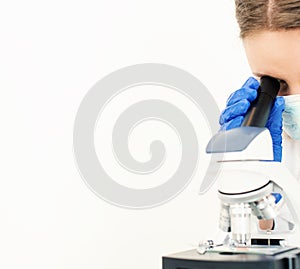 Doctor using microscope in laboratory.