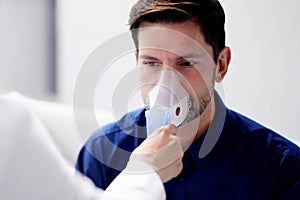 Doctor using nebulizer mask