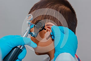 doctor using ostomoscope child eye exam