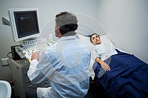 Doctor using sonography machine