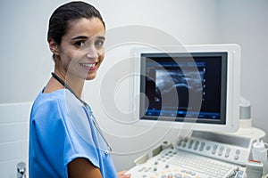 Doctor using sonography machine in hospital