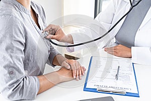 Doctor using a stethoscope checking patient with examining, presenting results symptom and recommend treatment method, Healthcare