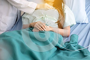 Doctor using stethoscope checking to asian women patient for listening heart rate on sickbed in hospital room,Close up