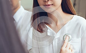 Doctor is using a stethoscope for patients patient examination.