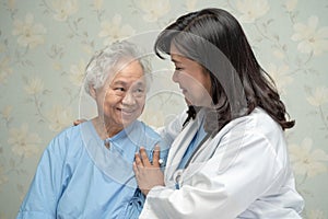 Doctor using stethoscope to checking the patient sit down on a bed in the hospital ward, healthy strong medical concept