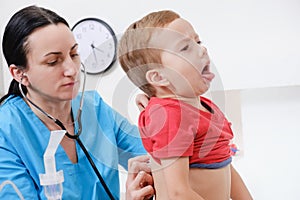 Doctor using stethoscope to examining little sweet boy