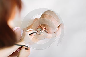 Doctor Using A Stethoscope To Listen To Baby`s back , Baby Health Concep