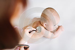 Doctor Using A Stethoscope To Listen To Baby`s back , Baby Health Concep