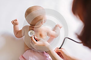 Doctor Using A Stethoscope To Listen To Baby`s back , Baby Health Concep
