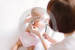 Doctor Using A Stethoscope To Listen To Baby`s back , Baby Health Concep