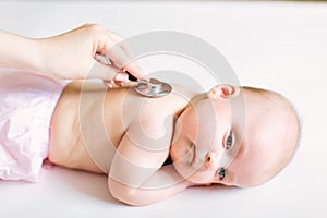 Doctor Using A Stethoscope To Listen To Baby`s back , Baby Health Concep