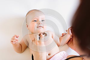 Doctor Using A Stethoscope To Listen To Baby`s Chest , Baby Health Concep