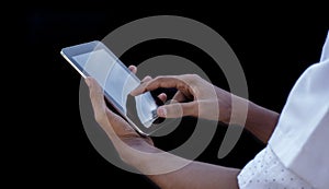 Doctor using tablet computer, close-up of hands at touch pad screen. Medicine concept