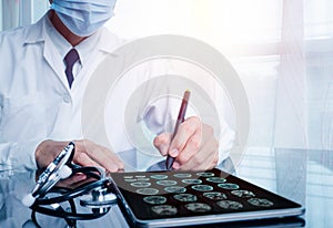The doctor is using a tablet computer,Research and analysis,Diagnose a patient's brain testing results using a tablet screen