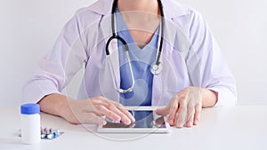 Doctor using tablet for medical and clinical online searching . healthcare with technology concept