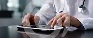 The doctor using a tablet for patient management in a clinical setting..AI generated image photo