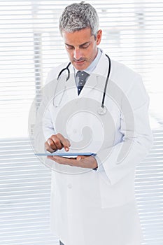 Doctor using tablet pc
