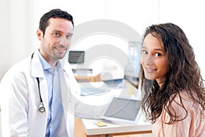 Doctor using tablet to inform patient