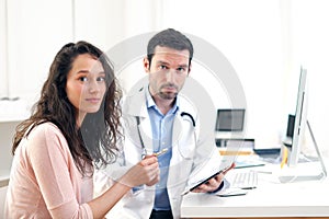 Doctor using tablet to inform patient