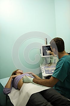 Doctor using ultrasound machine