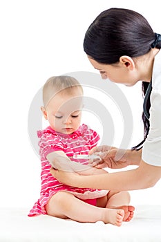 Doctor vaccinating baby isolated on a white