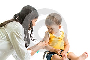 Doctor vaccinating kid boy isolated