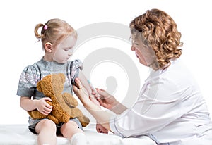 Doctor vaccinating kid isolated