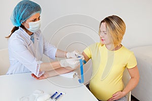 Doctor vaccinating a pregnant woman