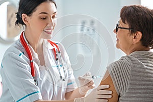 Doctor vaccinating a woman