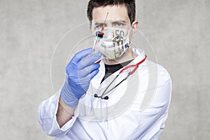 Doctor with a vaccine in his hand, a euro mask symbolizing the profit from the sale of vaccinations