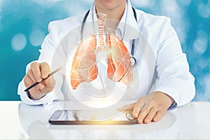 The doctor on the virtual screen shows a model of a human lung.