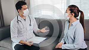Doctor visited the patient while wearing a mask at home to check the patient treatment during the virus epidemic photo