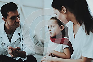 Doctor Visiting Little Girl in Red Scarf with Cold