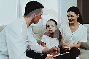 Doctor Visiting Little Girl in Red Scarf with Cold