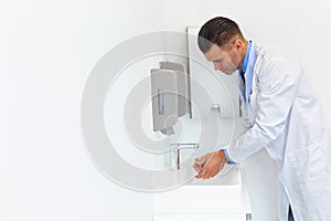 Doctor Washes Hands Before Medical Work. Dental Clinic photo
