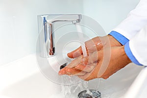 Doctor Washes Hands Before Medical Work. Dental Clinic photo