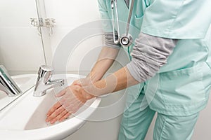 doctor washing hands before operating