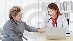 Doctor wearing and hold stethoscope on asian senior elderly woman for listening to internal sounds of patient body in examination