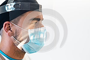 Doctor wearing ppe face surgical mask and visor fighting against corona virus outbreak