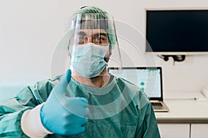 Doctor wearing ppe face surgical mask and visor fighting against corona virus outbreak