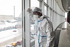 Doctor wearing ppe face surgical mask and visor fighting against corona virus outbreak. Health care and medical workers concept