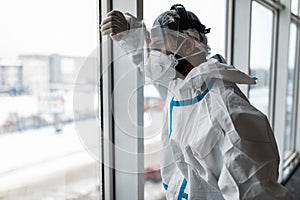 Doctor wearing ppe face surgical mask and visor fighting against corona virus outbreak. Health care and medical workers concept