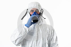 Doctor wearing protective biological suit and mask due to coronavirus 2019-nCoV global pandemic warning and danger