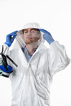 Doctor wearing protective biological suit and mask due to coronavirus 2019-nCoV global pandemic warning and danger