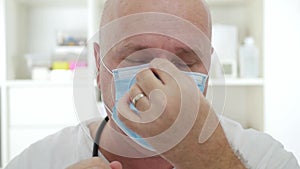 Doctor Wearing Protective Face Mask, Medical Person with Protection Equipment in a Quarantined Hospital Against Coronavirus Epidem