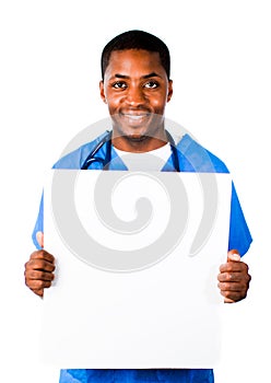 Doctor wearing scrubs and holding a white card